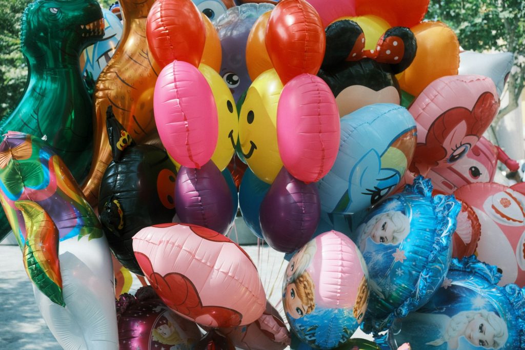 A bunch of balloons that are in the shape of animals